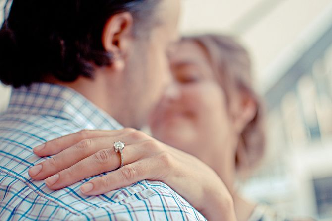 wife's ring finger on husband's shoulder